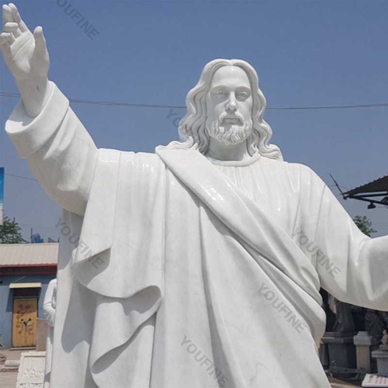 Outside Jaint catholic white marble church statues of christ Jesus making for parish garden